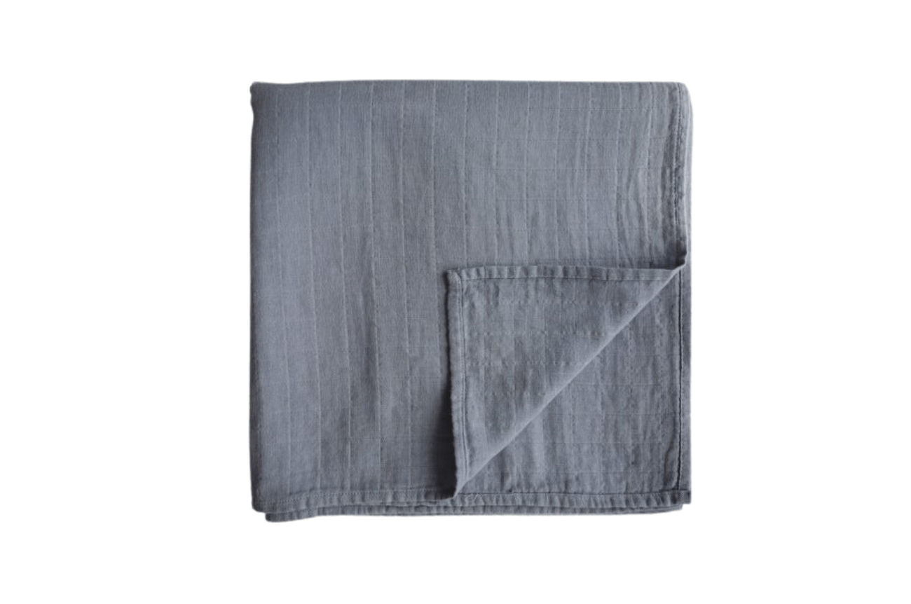 https://www.thewastelessshop.com/cdn/shop/files/mushie-tradewinds-organic-muslin-swaddle-blanket-41556345880870_1800x1800.png?v=1685056783